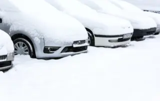 Cars in a snowy parking lot